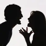 Two silhouettes facing each other, appearing to be shouting or arguing.