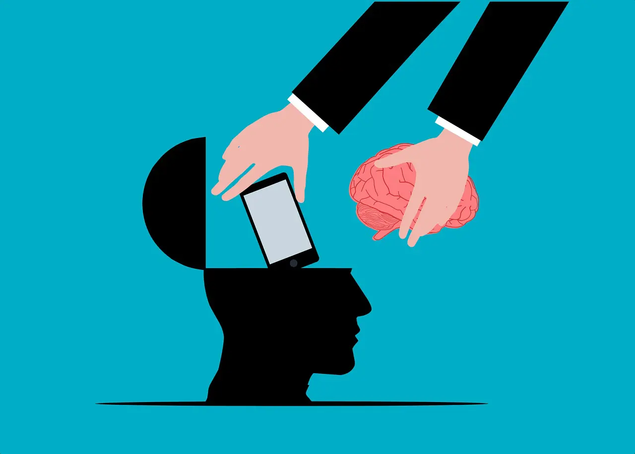 A silhouette of a head with a brain being replaced by a smartphone, suggesting the impact of technology on the mind.