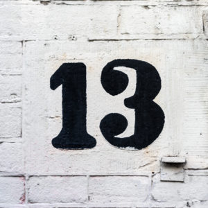 white brick wall with 13 number in black
